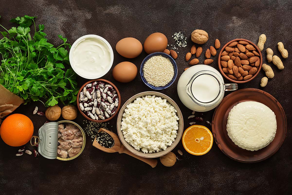 Variety of calcium-rich foods on a table, showcasing essential nutrition for bone health