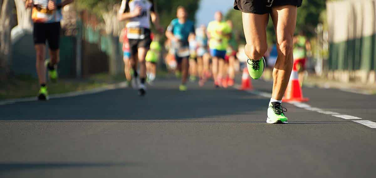 Group of runners in a marathon, reflecting the endurance of an osteoporosis advocate